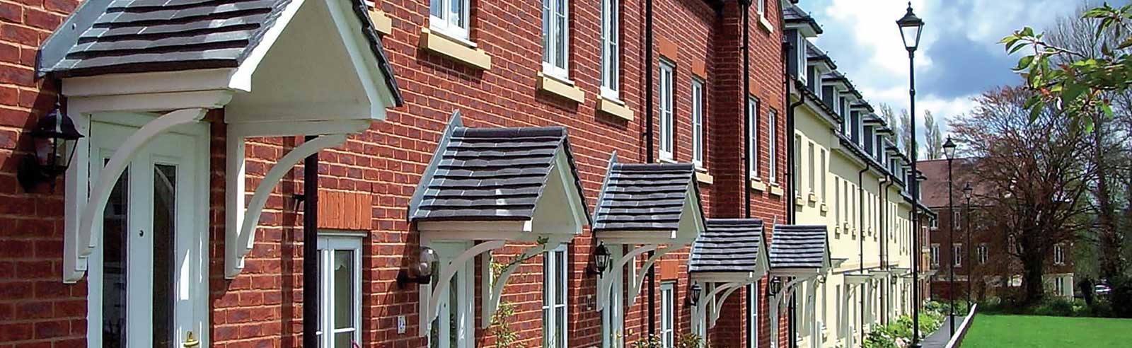 Terrace houses with white uPVC entrance doors